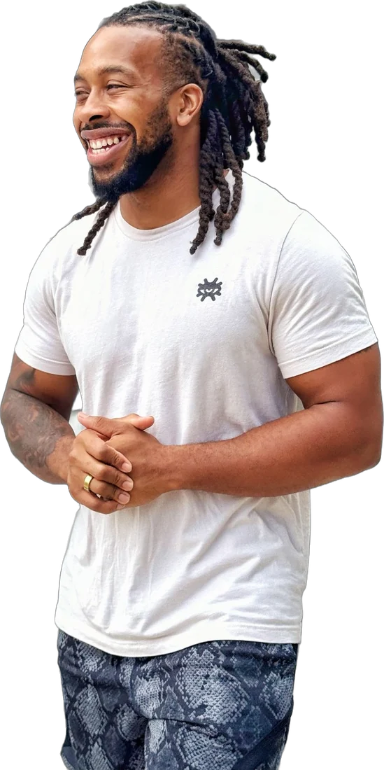 Quan Pratt smiling in a white tee