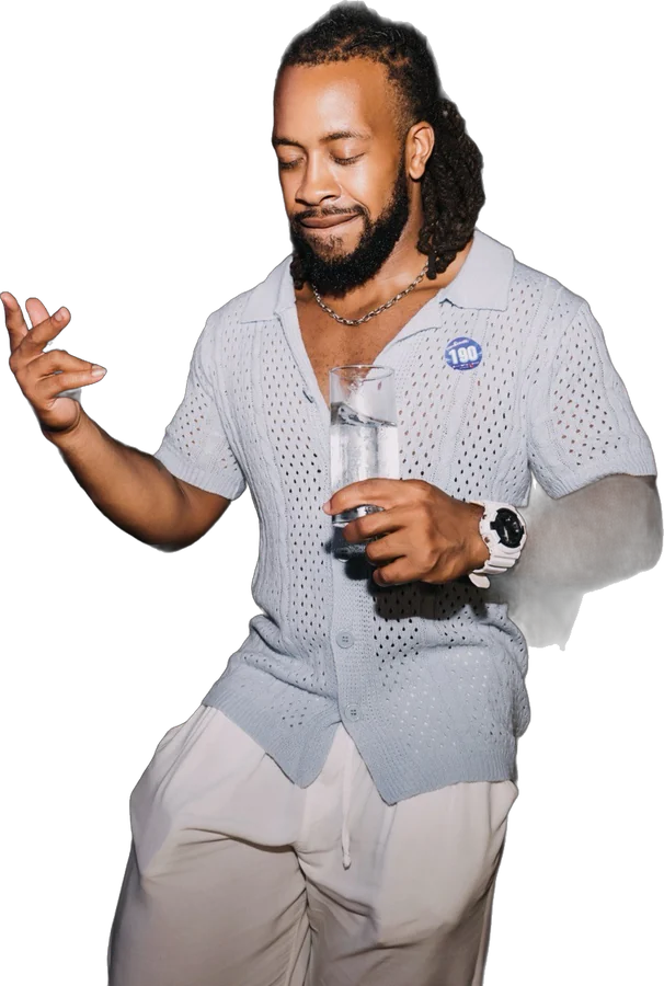 Quan vibing at a party with a drink
